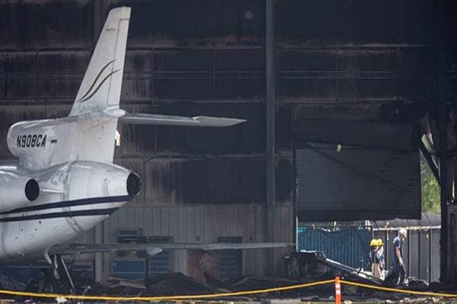 National Transportation Safety Board and FBI investigators inspect a hangar at Addison Airport in Addison, Texas. (AP Photo) National Transportation Safety Board and FBI investigators inspect a hangar at Addison Airport in Addison, Texas. (AP Photo)