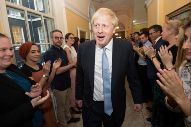 Britain's Prime Minister Boris Johnson is welcomed in 10 Downing Street by staff (Reuters photo) Britain's Prime Minister Boris Johnson is welcomed in 10 Downing Street by staff (Reuters photo)