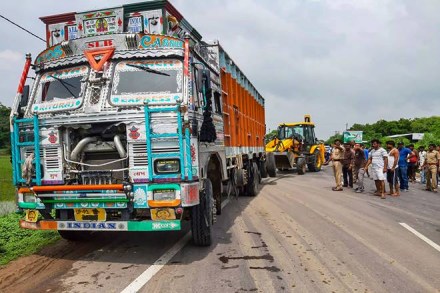 People stand near the site of accident in which the Unnao rape survivor was seroiusly injured after the car in which she was travelling collided with a truck, near Raebareli. (PTI Photo)