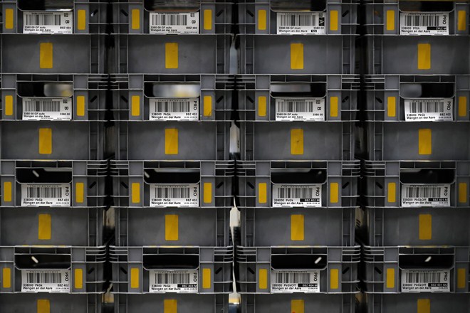 Identification barcode labels sit on the exterior of boxes containing letters at a Swiss Post International Holding AG letter sorting center in Harkingen, Switzerland, on Thursday, Aug. 21, 2018. The Swiss post office has seen the number of packages from abroad rise 10 percent this year, according to Oliver Flueeler, a spokesman for Swiss Post. Photographer: Stefan Wermuth/Bloomberg Identification barcode labels sit on the exterior of boxes containing letters at a Swiss Post International Holding AG letter sorting center in Harkingen, Switzerland, on Thursday, Aug. 21, 2018. The Swiss post office has seen the number of packages from abroad rise 10 percent this year, according to Oliver Flueeler, a spokesman for Swiss Post. Photographer: Stefan Wermuth/Bloomberg