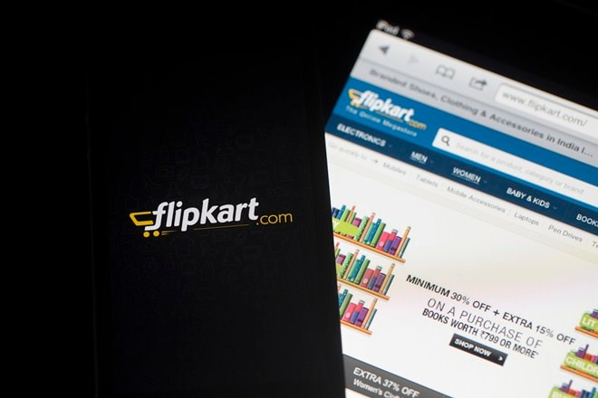 Flipkart's application loading page, left, and website are displayed on an Apple Inc. iPhone 5c and iPad respectively in an arranged photograph in Hong Kong, China, on Wednesday, May 21, 2014. Flipkart, India's largest online retailer, will buy competitor Myntra.com, according to people with knowledge of the talks, to gain a business with higher margins and strengthen its position in the local market against Amazon.com Inc. Photographer: Brent Lewin/Bloomberg