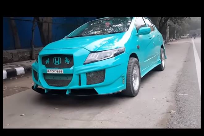 'My eeeeyes!!' Did you react like that? No? You will when you focus on the front grille which has not one but two prancing horses and then on the inside the Teal colour treatment continues and then it has a cobra's head for gearshift knob and then it has neon lights under it. Apparently, it's meant to look like a Mustang Shelby.