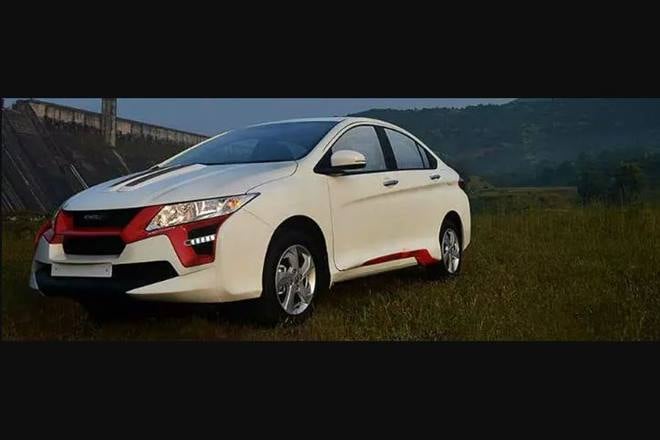 And now, let's talk about the professionals having a go at modifying the Honda City. This one was done by DC Design. It gets modified bumpers, body moulding, a red grille, and a rear diffuser. Also, there's a fake air scoop on the bonnet. At least, it's not as ghastly as the previous one.