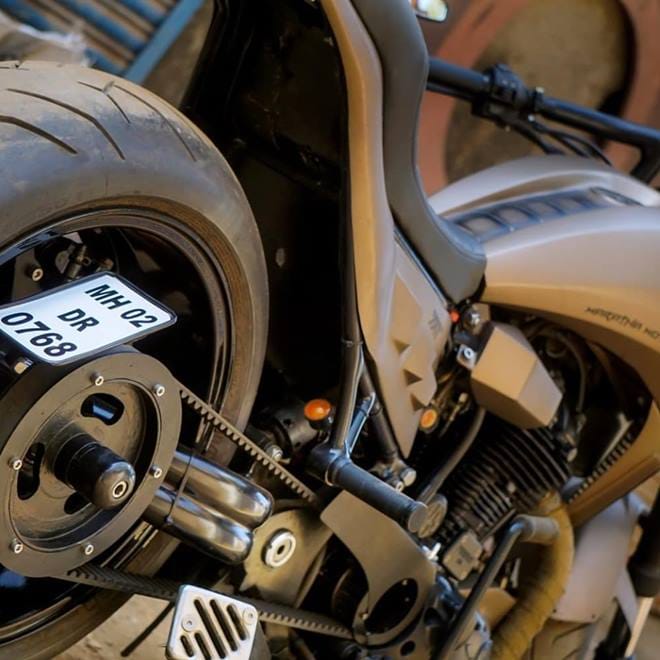 The swingarm has been replaced as well with a custom-built single-sided unit and the Royal Enfield now has a belt drive instead of the original chain drive. For added classic appeal, it gets bar-end rear view mirrors.