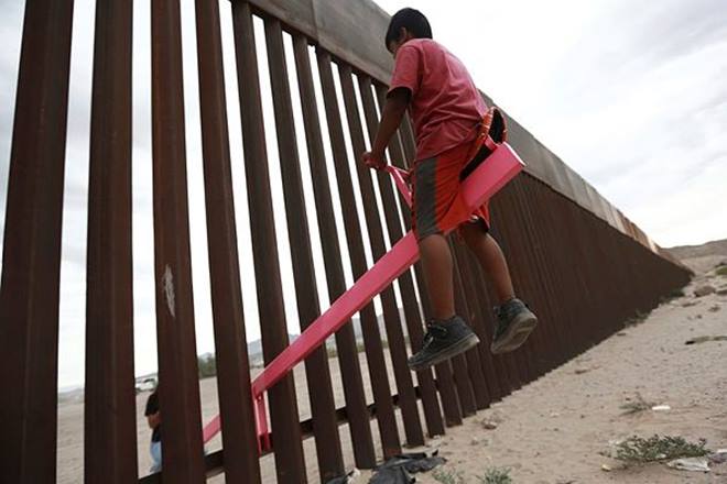 Seesaw, US, Mexico, US Mexico border, play together, UCLA, Donald Trump Seesaw, US, Mexico, US Mexico border, play together, UCLA, Donald Trump