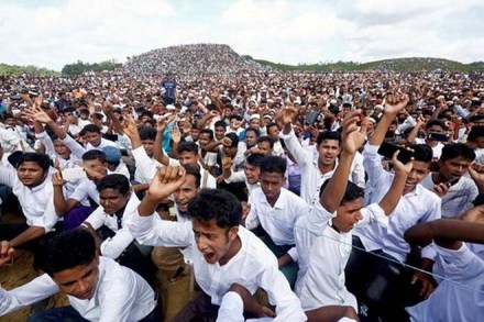 Rohingya refugees shout slogans as they gather to mark the second anniversary of the exodus at the Kutupalong camp in Cox’s Bazar, Bangladesh (Reuters)