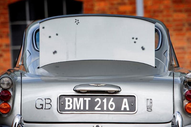 Shots fired? The retractable bullet-proof screen will protect you! The screen, which emerges from the back of the car and creates a barrier between the oncoming bullets the the rear windscreen. (Image Credits: RM Sotheby's)