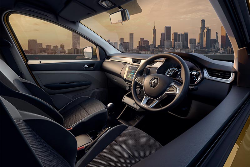 The Renault Triber features a black and grey, dual-tone interior with silver accents. The entire dash and cockpit features only a few buttons. The main one being the start-stop button, and the switchgear for climate control, with a few additional buttons for the door lock and unlock, and the rear defogger as well. Renault has also equipped the Triber with rear AC vents.