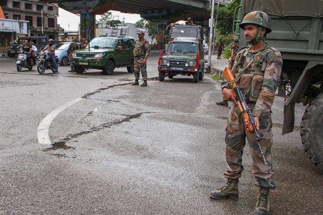 Army personnel stand guard during restrictions, in Jammu. (PTI Photo)