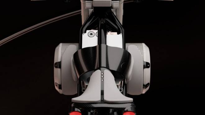 The cylindrical battery extends laterally like BMW's boxer-engine case, the power electronics ride up high where a tank would usually sit, pegs jut from scaffolding encasing the electric motor, hung at the bike's pivot.