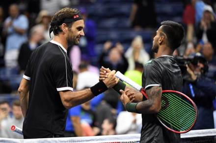 Roger Federer of Switzerland, left, and Sumit Nagal of India shake hands after their match in the first round US at USTA Billie Jean King National Tennis Center. (Photo: Danielle Parhizkaran/USA TODAY Sports)