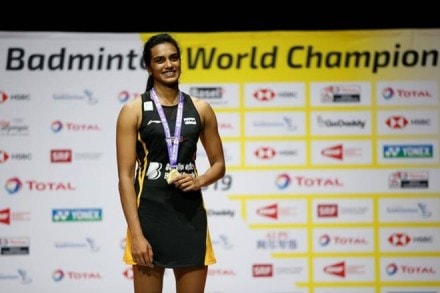 PV Sindhu celebrates on the podium with her gold medal after winning the women's singles final. (Reuters)