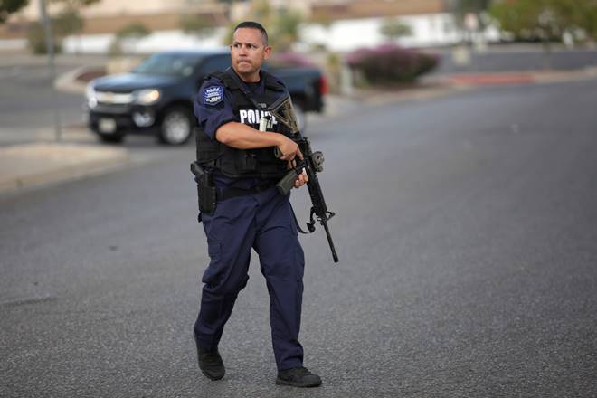 A police officer is seen after a mass shooting at a Walmart in El Paso, Texas. (Reuters) A police officer is seen after a mass shooting at a Walmart in El Paso, Texas. (Reuters)