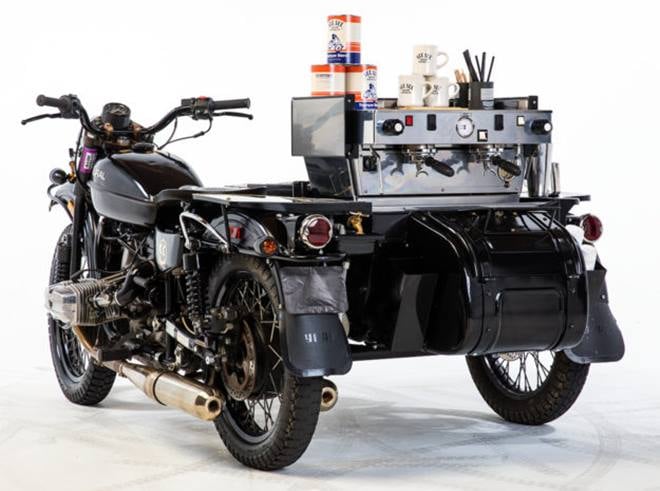 Ural sidecar with an espresso machine: See See Motorcycles, as it turns out, do more than custom build bikes. While their customs are sheer coolness, this one with an espresso also has a hand sink, a pitcher cleaner, a built-in cooler, a coffee grinder, plenty of storage, and a 220v/110v electrical panel. (Source: Bikeexif)