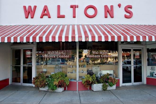 A sign for Walton's 5&10, the forerunner to today's Wal-Mart stores, hangs above what now serves as the Wal-Mart Visitors Center in Bentonville, Arkansas, U.S. Thursday, Sept. 20, 2007. The Walton's store was opened by Sam Walton on May 9, 1950. A sign for Walton's 5&10, the forerunner to today's Wal-Mart stores, hangs above what now serves as the Wal-Mart Visitors Center in Bentonville, Arkansas, U.S. Thursday, Sept. 20, 2007. The Walton's store was opened by Sam Walton on May 9, 1950.