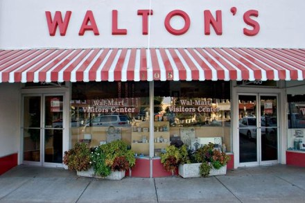 A sign for Walton's 5&10, the forerunner to today's Wal-Mart stores, hangs above what now serves as the Wal-Mart Visitors Center in Bentonville, Arkansas, U.S. Thursday, Sept. 20, 2007. The Walton's store was opened by Sam Walton on May 9, 1950.