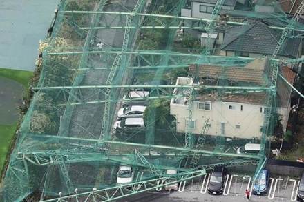 Houses and cars damaged by a collapse of the perimeter netting of a golf training field due to strong winds of Typhoon Faxai are seen in Ichihara, east of Tokyo, Japan (Reuters) Houses and cars damaged by a collapse of the perimeter netting of a golf training field due to strong winds of Typhoon Faxai are seen in Ichihara, east of Tokyo, Japan (Reuters)