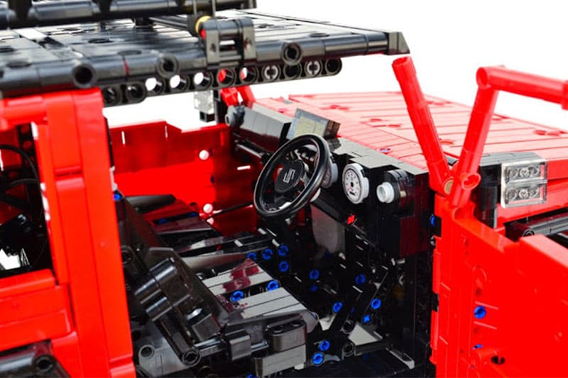 The interiors of the Lego Suzuki Jimny are laid-out in utmost detail as well. It gets a dashboard which mimics the real deal. There is a steering wheel with a Suzuki logo, a twin-pod instrument cluster and a Lego block that represents the 7-inch touchscreen infotainment system seen on the off-roader.