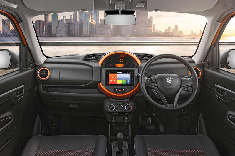 Maruti has revealed the interior and dash of the S-Presso featuring a design which seems to be inspired from modern Minis and as expected, it features a centrally mounted instrument cluster, with a digital speedometer on top, flanked by the central air vents. Below that, is the touch-screen infotainment screen featuring Maruti Suzuki’s SmartPlay Studio interface. The front windows are power operated and the buttons are placed on the dash flanking the hazard warning button. The entire cabin uses an all black layout with orange accents on the dash and around the air vents.