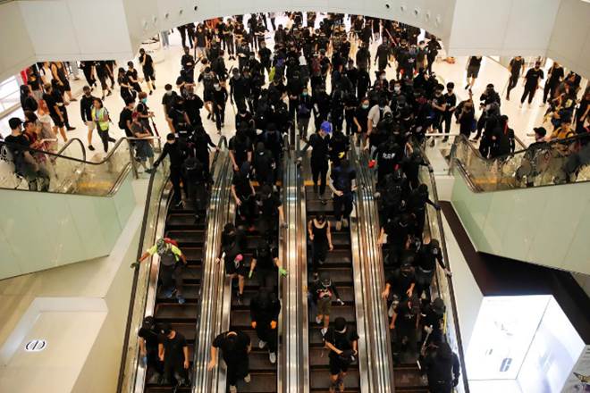 Multiple pro-democracy activists have been attacked by pro-Beijing supporters in recent months (Reuters image)