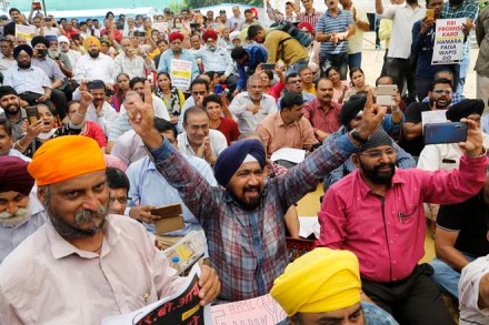 People shout slogans as depositors of PMC Bank protest against Reserve Bank of India in Mumbai. (AP Photo)