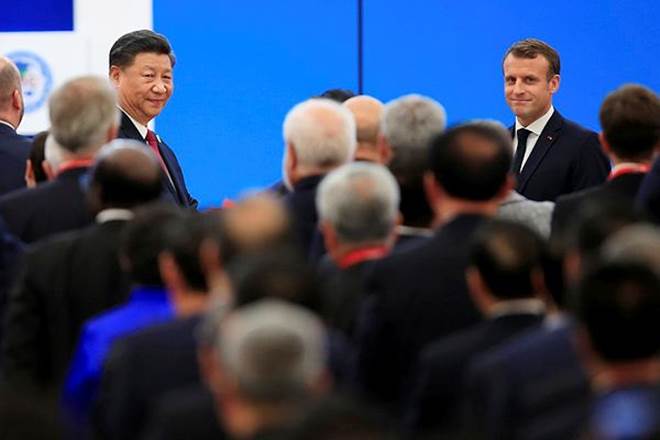 Chinese President Xi Jinping and French President Emmanuel Macron attend the opening ceremony of the second China International Import Expo (CIIE) in Shanghai (Reuters)