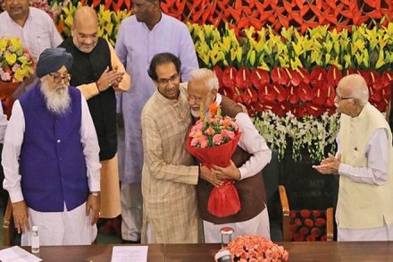 Prime Minister Narendra Modi, center, hugs Shiv Sena party chief Uddhav Thackeray after being elected as Bharatiya Jananta Party and ruling alliance leader, in New Delhi Prime Minister Narendra Modi, center, hugs Shiv Sena party chief Uddhav Thackeray after being elected as Bharatiya Jananta Party and ruling alliance leader, in New Delhi