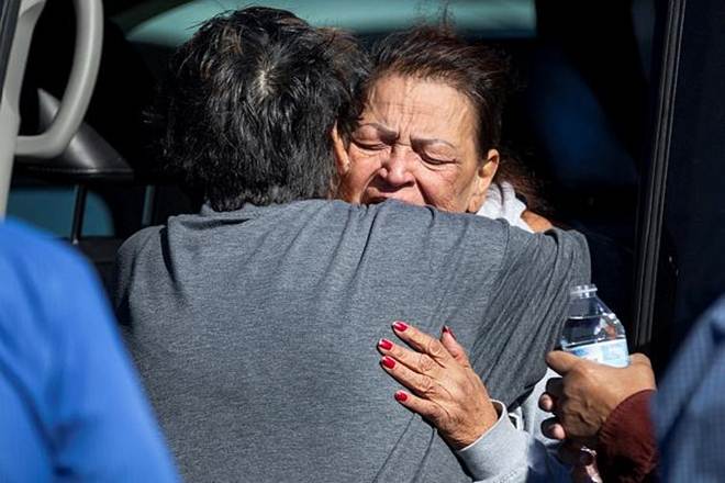A family member reacts at the scene of a fatal shooting in the parking lot of a Walmart in Duncan, Okla., on Monday. (AP Photo)