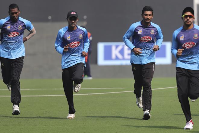 Bangladesh players warm up during a practice session ahead of their third T20 international cricket match against India in Nagpur. (AP Photo) Bangladesh players warm up during a practice session ahead of their third T20 international cricket match against India in Nagpur. (AP Photo)