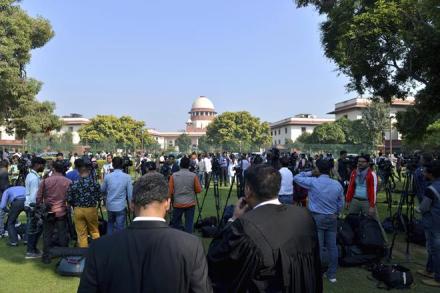 A crowd gathers outside the Supreme Court in New Delhi. (AP Photo)