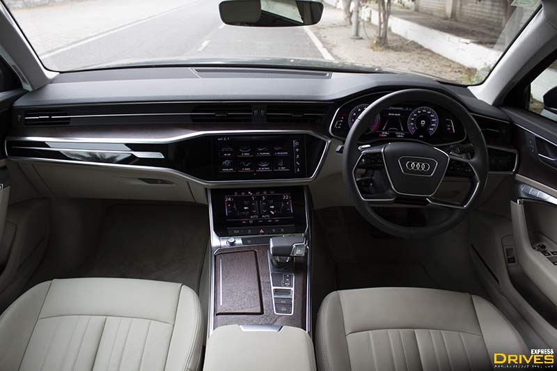 The cabin of the new Audi A6 is replete with screens and high-quality materials. The dashboard gets a layered design and materials of different textures and colours are used here. There is soft-touch material used on the top panel of the dashboard, piano black surrounds around central console, wood-inserts on the central tunnel with leather upholstery on the seats.