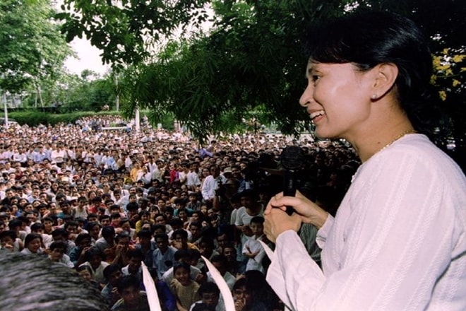 Aung San Suu Kyi smiles while speaking to hundreds of supporters from the gate at her residential compound in Yangon, Myanmar. (Reuters File) Aung San Suu Kyi smiles while speaking to hundreds of supporters from the gate at her residential compound in Yangon, Myanmar. (Reuters File)