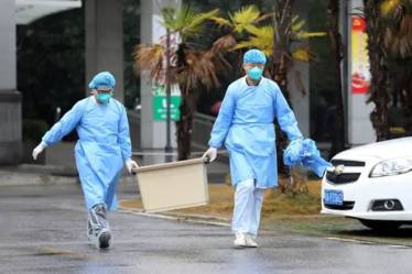 China records first virus death in Beijing as toll passes 100