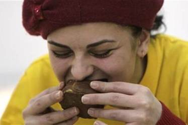 Lamingtons, a traditional Australian dessert, are cube-shaped sponge cakes dipped in chocolate and covered in grated coconut. (Representational Image: Reuters)
