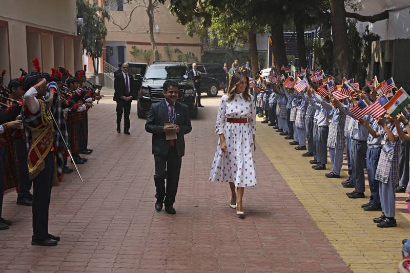 melania trump in india images, melania trump dress, melania trump fashion, melania trump dress images, melania trump india visit, delhi school, taj mahal, sabarmati ashram, motera stadium, namaste trump