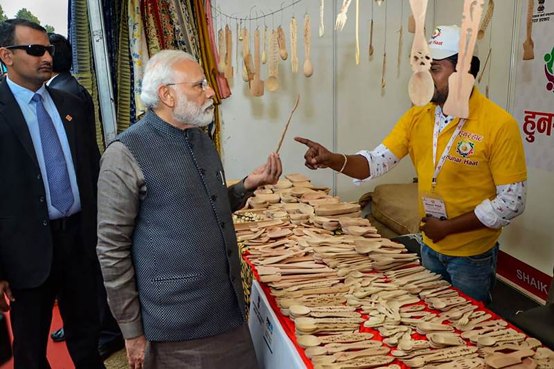 PM Modi even tried playing a musical instrument at one of the stalls. The Hunar Haat is based on the theme of 'Kaushal Ko Kaam' and will be held till February 23, news agency PTI said. (PTI photo)
