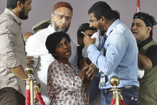 Asaduddin Owaisi watches as organizers prevent Amulya from raising pro-Pakistan slogans. (AP Photo) Asaduddin Owaisi watches as organizers prevent Amulya from raising pro-Pakistan slogans. (AP Photo)