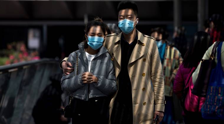 A personnel wearing protective suit waits near an entrance at the Cheung Hong Estate, a public housing estate during evacuation of residents in Hong Kong, Tuesday, Feb. 11, 2020. The Centre for Health Protection of the Department of Health evacuated some residents from the public housing estate after two cases of novel coronavirus infection to stop the potential risk of further spread of the virus. (AP Photo/Kin Cheung) A personnel wearing protective suit waits near an entrance at the Cheung Hong Estate, a public housing estate during evacuation of residents in Hong Kong, Tuesday, Feb. 11, 2020. The Centre for Health Protection of the Department of Health evacuated some residents from the public housing estate after two cases of novel coronavirus infection to stop the potential risk of further spread of the virus. (AP Photo/Kin Cheung)