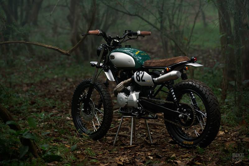 Adhil has finished the Karizma with off-the-shelf handlebars, grips, lights and turn signals, and a tank that he bought off a scrap dealer. He made a host of small changes too; a custom gearshift linkage, custom passenger pegs, and a full rewire. The fuel tank comes from a Yamaha RD 175. Adhil named the bike ‘Katalan,’ which, in his native language of Malayalam, means ‘a hunter born in the wild.’ (Image: Bikeexif)