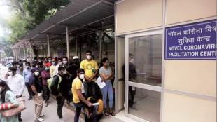 People with symptoms queue outside a Novel Coronavirus facilitation centre at RML Hospital in New Delhi (Express Photo)