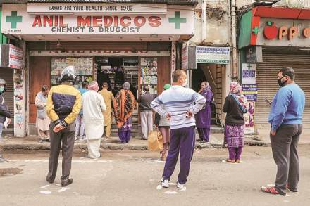 People stand outside a pharmacy to buy medicines during a nationwide lockdown, imposed in the wake of coronavirus pandemic, in Jammu (PTI photo) People stand outside a pharmacy to buy medicines during a nationwide lockdown, imposed in the wake of coronavirus pandemic, in Jammu (PTI photo)