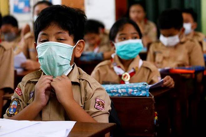 Students wear protective masks in school after Indonesia confirmed its first cases of COVID-19, in Jakarta, Indonesia. (Courtesy: Reuters photo)