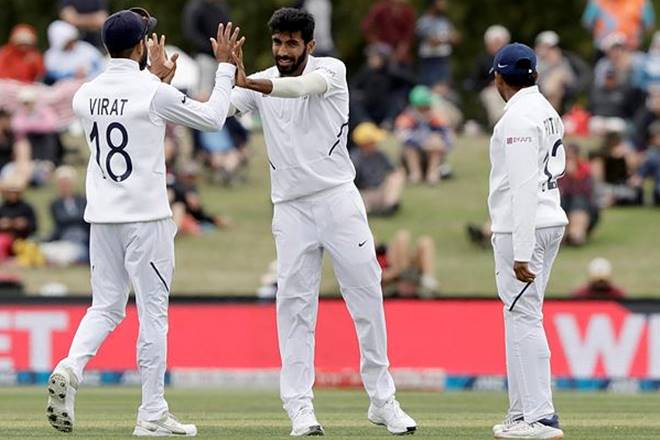 Jasprit Bumrah is congratulated by his captain Virat Kohli after dismissing New Zealand's Kane Williamson during play on day three of the second cricket test between New Zealand and India at Hagley Oval in Christchurch, New Zealand. (Courtesy: AP photo)
