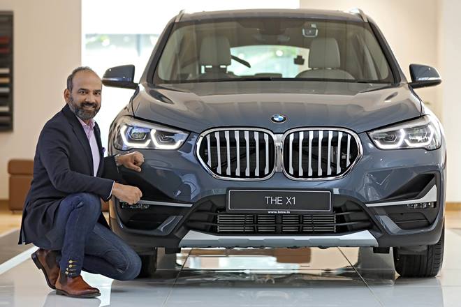 Rudratej Singh, President and Chief Executive Officer, BMW Group India, with a BMW X1