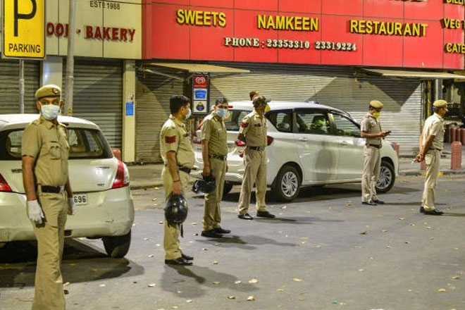 Police officials seal the Bengali Market area amid Covid19 scare. (PTI Photo)