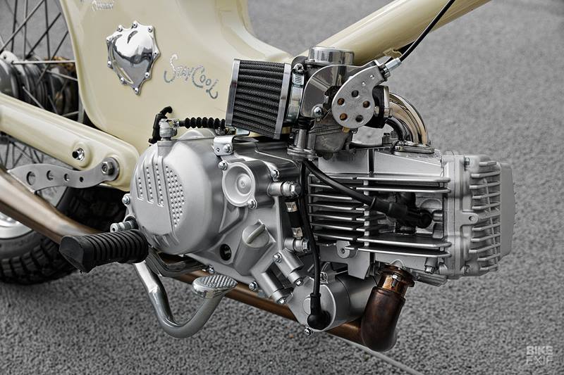The original front-end was dome away with, and replaced with forks from a Hartford HD200. That helped lift up and rake out the front, with a new set of aftermarket shocks adding more compliance at the rear. (Source: Bikeexif)