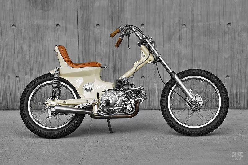 Taiwanese shop 2LOUD Custom have given us a super cute scoot to write about with this Honda Cub-based American chopper. When building a chopper, a Cub is probably not the first bike that comes to mind but are we glad that it did in this case. 2LOUD’s customer, a young woman, was very clear on what she wanted: “Cub plus chopper plus love.” And builders Ma ‘Max’ Yicheng and Lu Yongyu were all too happy to oblige. (Source: Bikeexif)