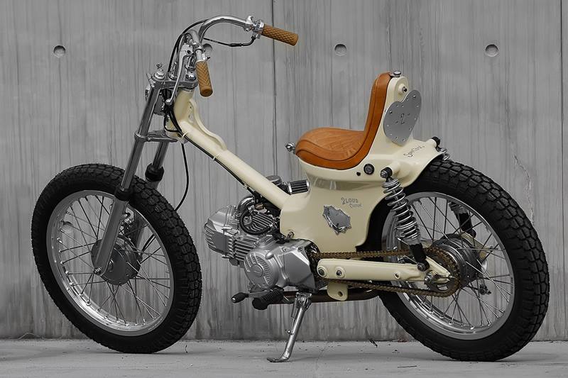 Other thoughtful little details are strewn throughout the build - note the cross-brace on the bars, the exhaust hanger and the main frame tube gusset; all of them have been drilled out to complement each other. Finished off with a simple cream paint job, this chopped Cub is quite the cutest two-wheeler ever to appear on this page. (Source: Bikeexif)