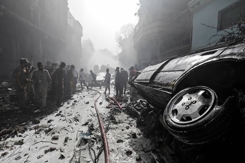 karachi air crash, karachi crash, Karachi air crash images, pakistan air crash images, pakistan plane crash images, PIA flight crash, pakistan plane crash, pakistan news, karachi airport crash latest news, pakistan air crash death toll, karachi, PIA crash news updates