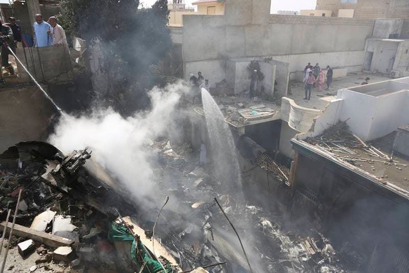 karachi air crash, karachi crash, Karachi air crash images, pakistan air crash images, pakistan plane crash images, PIA flight crash, pakistan plane crash, pakistan news, karachi airport crash latest news, pakistan air crash death toll, karachi, PIA crash news updates